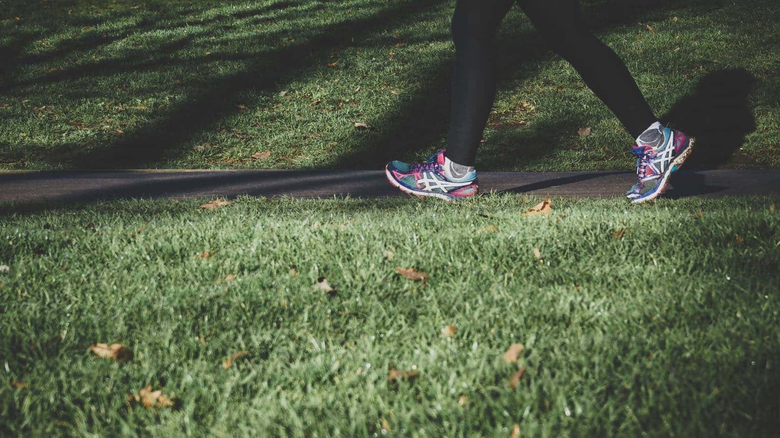 A person walking outdoors as part of an active weekly routine.